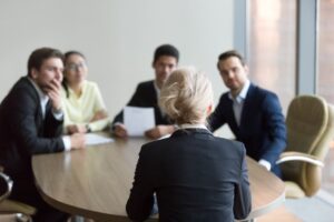 Woman facing an panel of interviewers